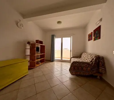 a living room with a couch and a window at Ca' Ale in Santa Maria