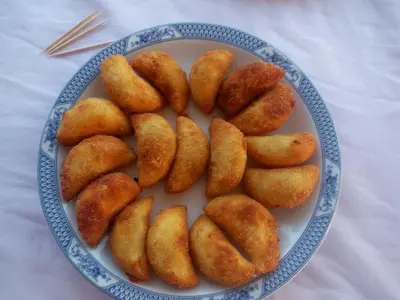 a blue and white plate of food on a table at Residencial Cosmos in Assomada