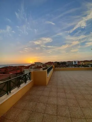 a view of the sunset from the roof of a building at Holiday Properties Commercial Center - Wi-fi in Santa Maria