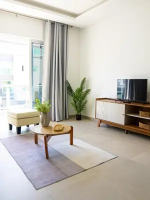 a living room with a tv and a coffee table at Casabeleza Cape Verde in Assomada