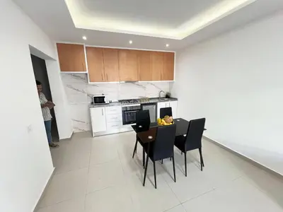 a kitchen and dining room with a table and chairs at Casabeleza Cape Verde in Assomada