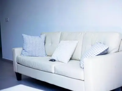 a white couch with pillows on it in a room at Casabeleza Cape Verde in Assomada
