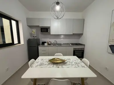a kitchen with a table with a gold bowl on it at Tarrafal Bay - 1Bdr Apt - 3 in Tarrafal