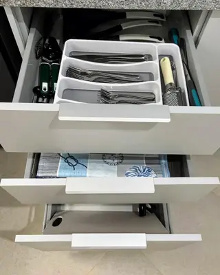 an open drawer with utensils in a cabinet at Tarrafal Bay - 1Bdr Apt - 3 in Tarrafal