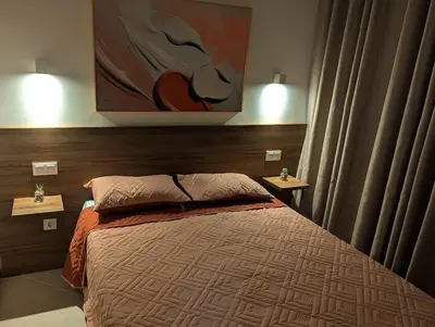 a bedroom with a bed and a painting on the wall at Tarrafal Bay - 1Bdr Apt - Sea view - 4 in Tarrafal