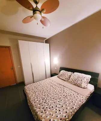a bedroom with a bed with a ceiling fan at Blu Jasmine in Sal Rei