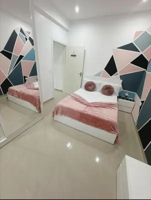 a bedroom with a bed and a mirror at Peace of mind in Praia