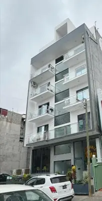 a white car parked in front of a building at Peace of mind in Praia