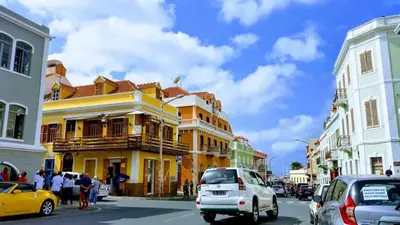 a yellow building on the side of a street at Hotel Lazareto in Mindelo