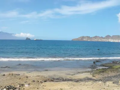 a view of the ocean with a ship in the distance at Hotel Lazareto in Mindelo