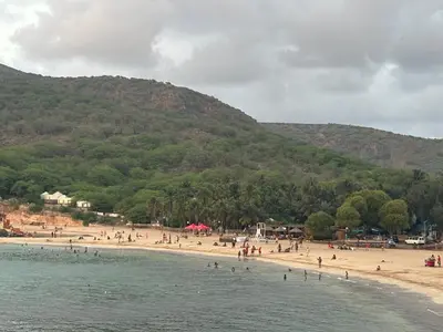 a group of people on a beach near the water at Techas Family Beach Stay 3BR in Central Tarrafal in Tarrafal
