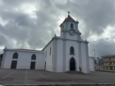 a large white church with a clock tower on it at Techas Family Beach Stay 3BR in Central Tarrafal in Tarrafal