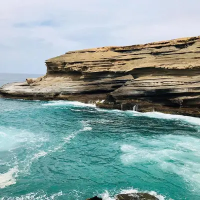 a view of the ocean next to a rocky cliff at Casa Magui e Cláudio in Tarrafal