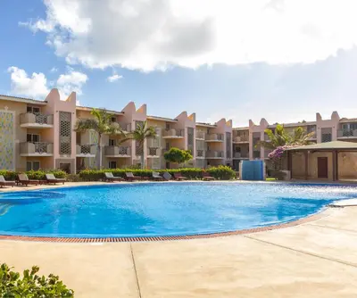 a swimming pool in front of a resort at POOLSIDE RETREAT - Tropical Apt B02 - PointingCaboVerde in Santa Maria