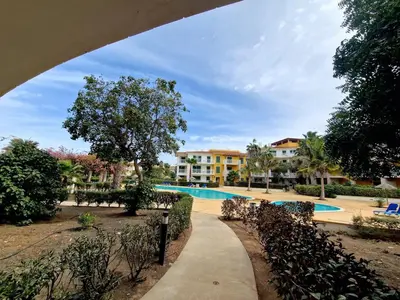 a walkway through a resort with a swimming pool at Stay, laugh, repeat! in Prainha