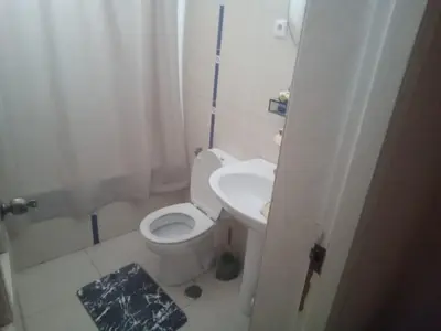 a small bathroom with a toilet and a sink at Morabeza Praia in Praia