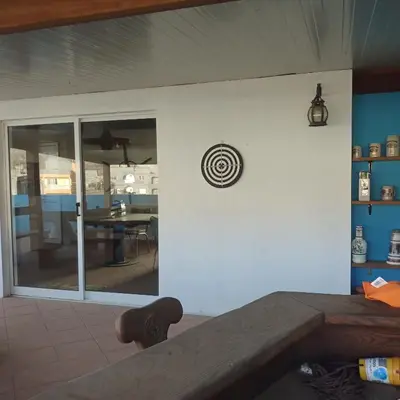 a room with a view of a dining room at Ca Azul in Tarrafal