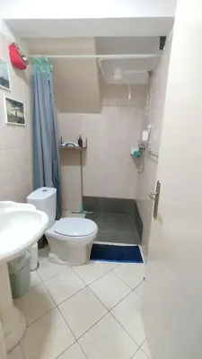 a bathroom with a toilet and a sink and a shower at Studio Murdeira Side Beach, Eco Protected Bay, Pool in Beirona