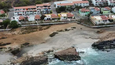 an aerial view of a beach with houses and water at Studio Murdeira Side Beach, Eco Protected Bay, Pool in Beirona