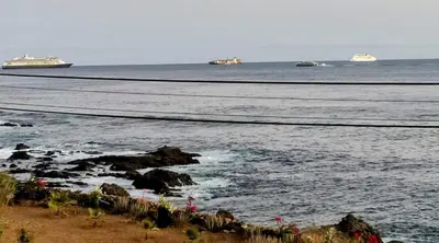 a view of the ocean with ships in the distance at brISA in Praia