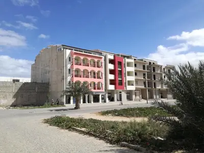 a large building with red and white at Casa Sara Boavista in Sal Rei