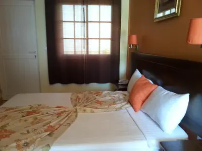 a bed in a room with a window and a bed sidx sidx sidx at Quinta Da Montanha in Rui Vaz