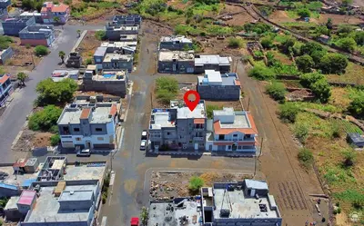 an aerial view of a city with a red sign at Casa Magui de Reis in Tarrafal