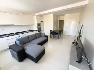 a living room with a couch and a table at 1 bdr charming central apt in Praça Center - LCGR in Praia
