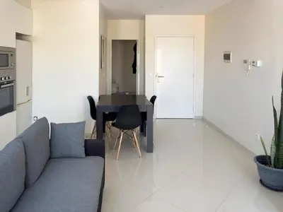 a living room with a couch and a table at 1 bdr charming central apt in Praça Center - LCGR in Praia