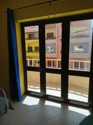 a room with a window with a view of a building at Appartamento Gianni in Santa Maria