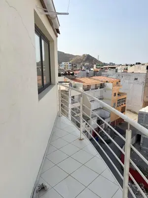 a balcony with a view of a city at 2 bdr charming central apt in Praça Center - LCGR in Praia