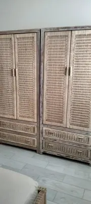 a wooden wall with wicker windows in a room at Girasole Apartments in Sal Rei
