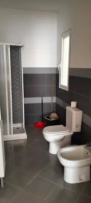 a bathroom with two toilets and a shower at Girasole Apartments in Sal Rei