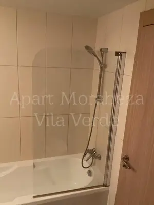 a shower with a glass door in a bathroom at Morabeza Vila Verde in Santa Maria