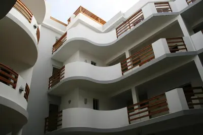 a large white building with wooden balconies at Endless Summer B6 in Sal Rei