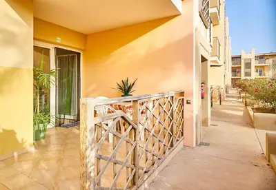 a balcony with a wooden fence in a building at Tropical Casa Verde Santa Maria G01 in Santa Maria