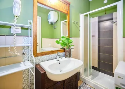 a bathroom with a sink and a shower at Tropical Casa Verde Santa Maria G01 in Santa Maria