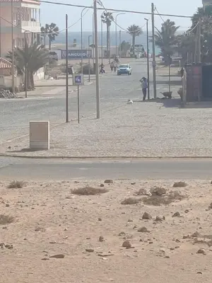 an empty street with a street sign in the sand at Appartamento Teresa in Santa Maria