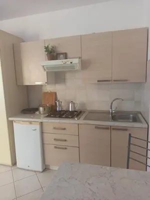 a kitchen with a sink and a stove top oven at Appartamento Teresa in Santa Maria