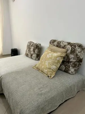 a bed with two pillows on top of it at Kubiku Guest House in Praia