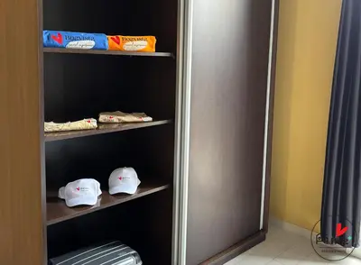 a closet with two shelves with hats on them at I LOVE BOA VISTA - Seafront Apartments in Sal Rei