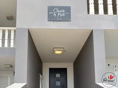 a sign on the side of a building with a door at I LOVE BOA VISTA - Seafront Apartments in Sal Rei