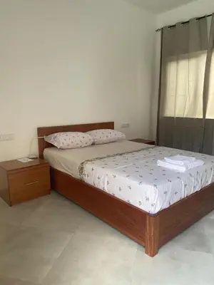 a bedroom with a bed and a window at Laranjinha Rooms in Paul