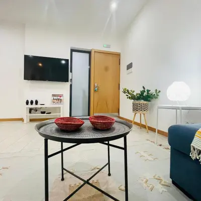 a living room with a table with two baskets on it at Sal Little Heart Blue Apartment 13 in Santa Maria