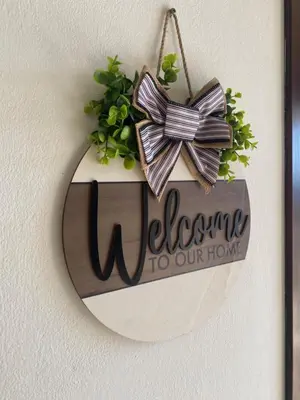 a sign that says welcome to our home with a bow at Tropical Miradouro in Santa Maria