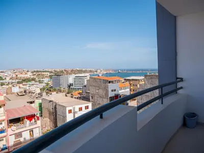 a balcony with a view of a city at Appartement moderne avec vue sur la mer in Praia