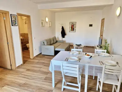 a living room with a white table and chairs at Holiferias NoStress Sal Island in Santa Maria