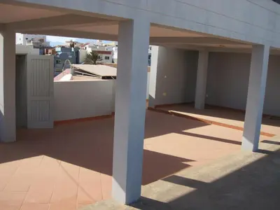 a balcony of a building with two white columns at Maya Mindelo 4 in Mindelo