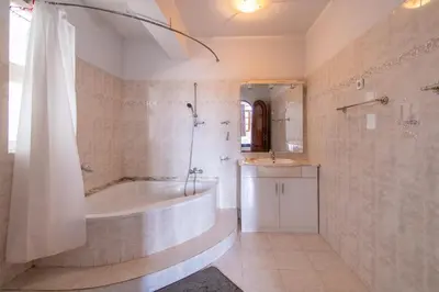a bathroom with a tub and a shower and a sink at Maya Mindelo 4 in Mindelo