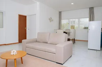 a living room with a couch and a table at Your Escape Home in Praia in Praia